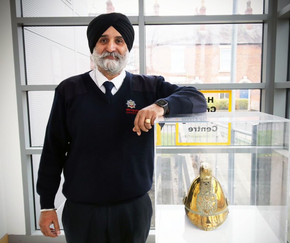 Man standing next to table 