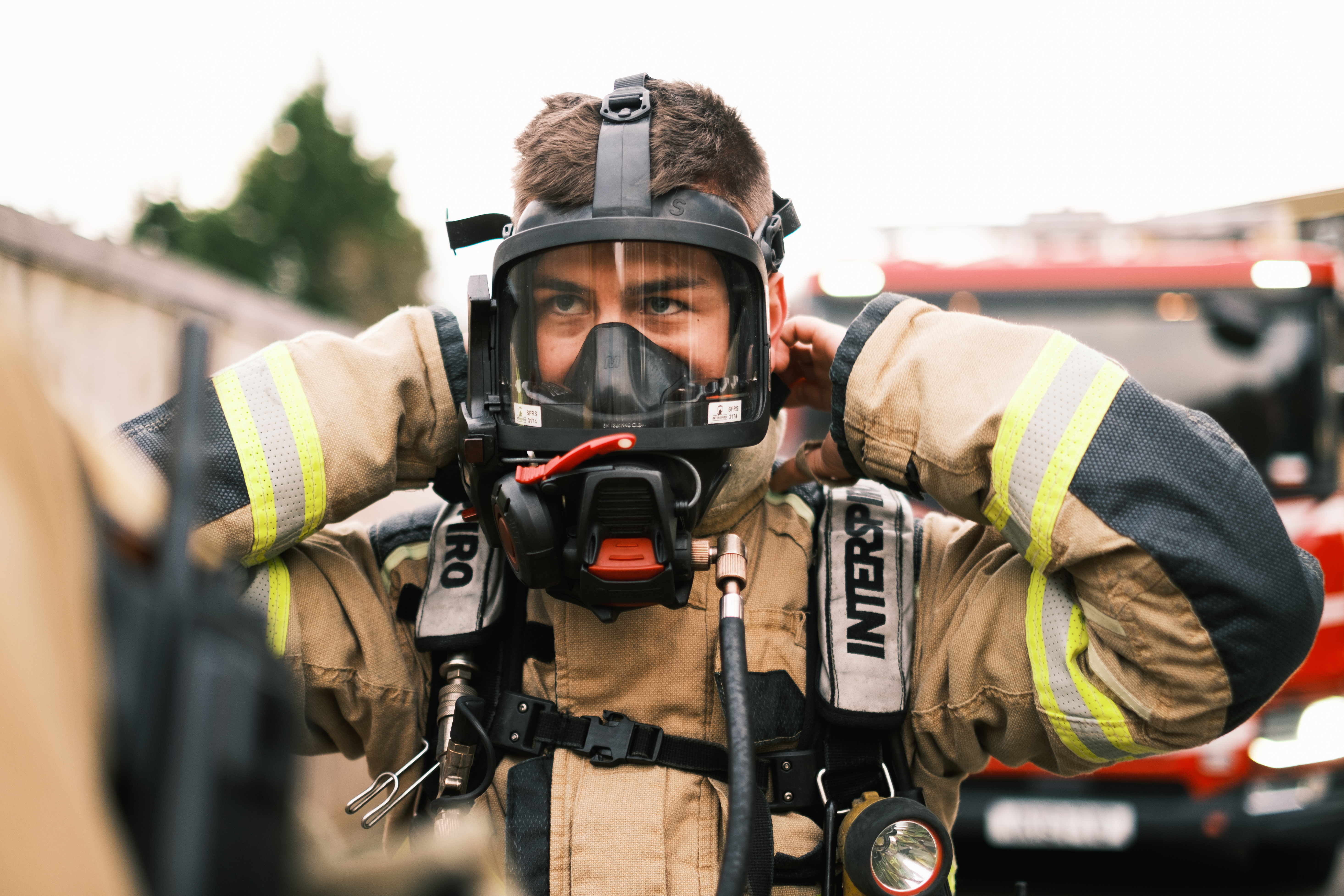 Worker putting mask on his face