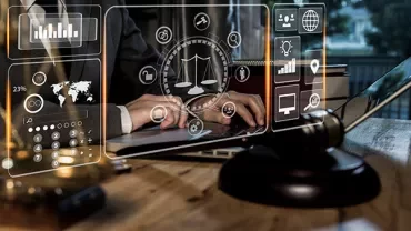 Person typing on laptop with digital justice icons overlay