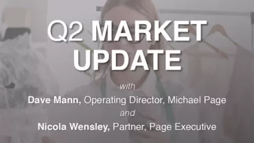 Q2 market update with two business professionals